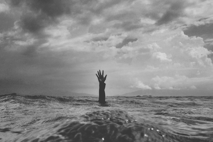 Depression: Hand sticking out of water