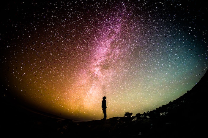 Man's silhouette looking at the stars