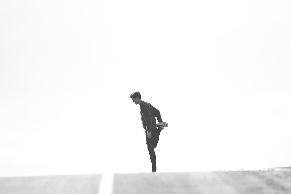 Man stretching his leg
