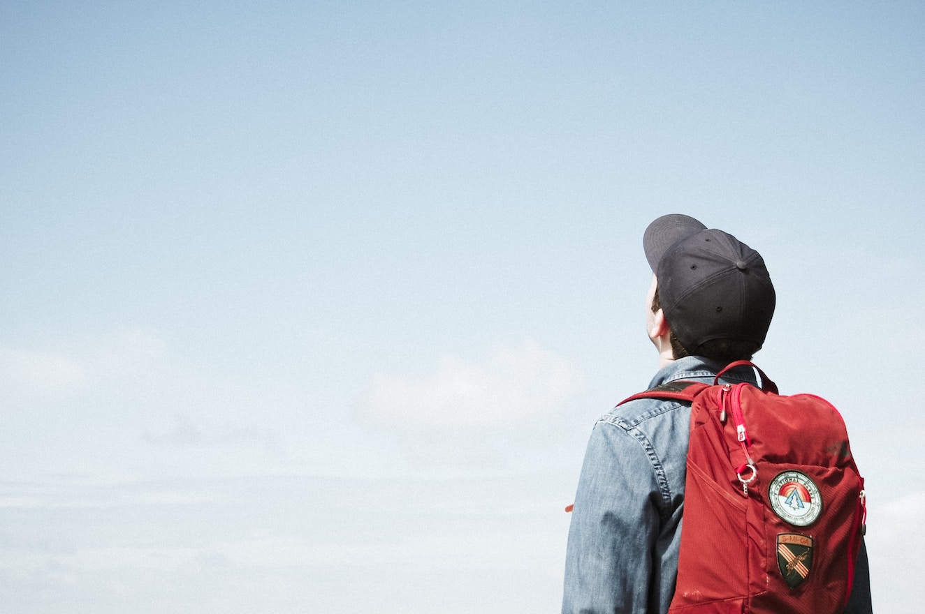 Man staring up at skies