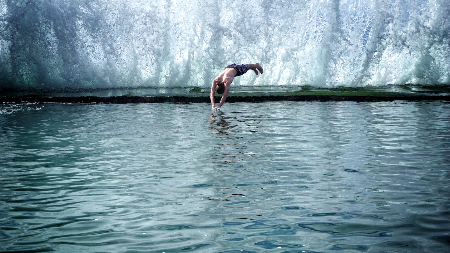Man diving into icy waters