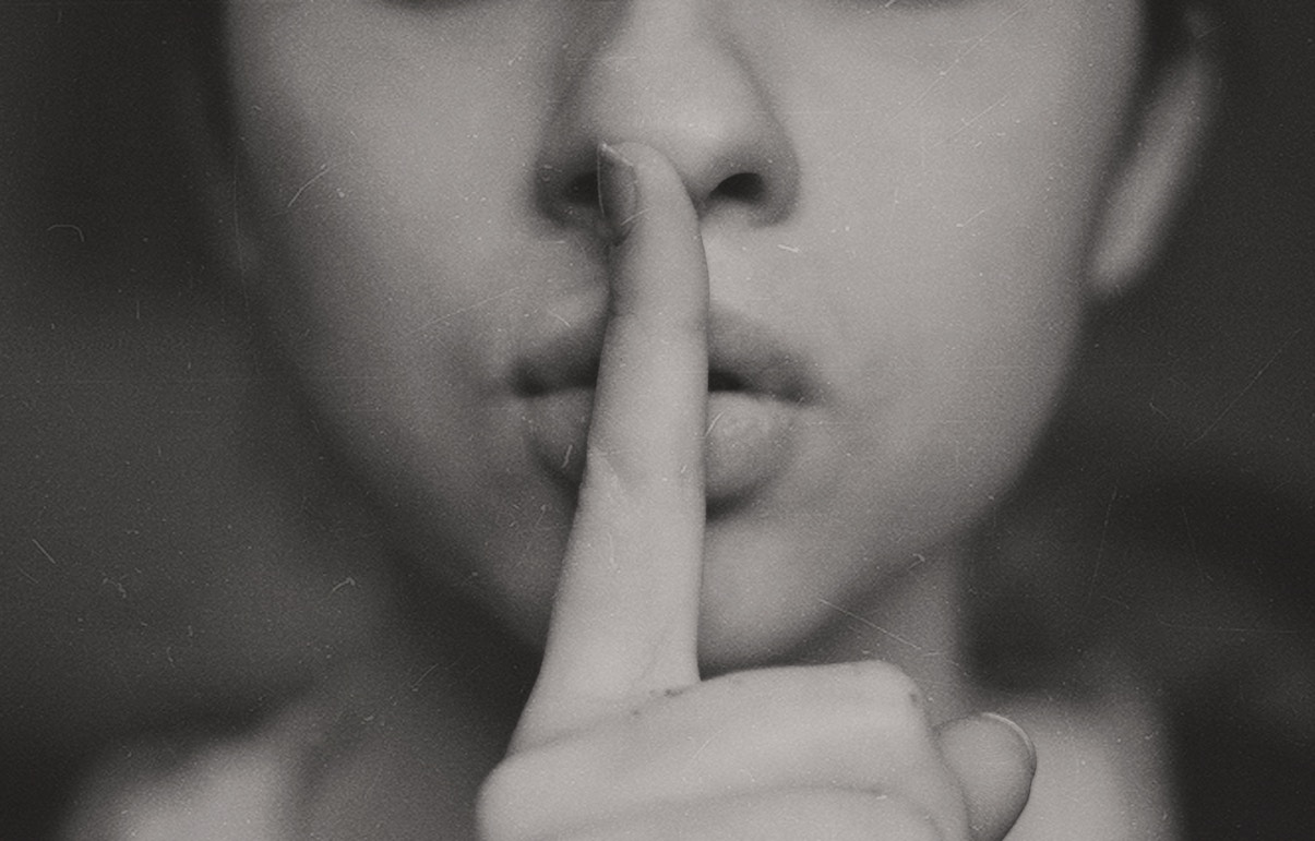 Woman doing hush sign