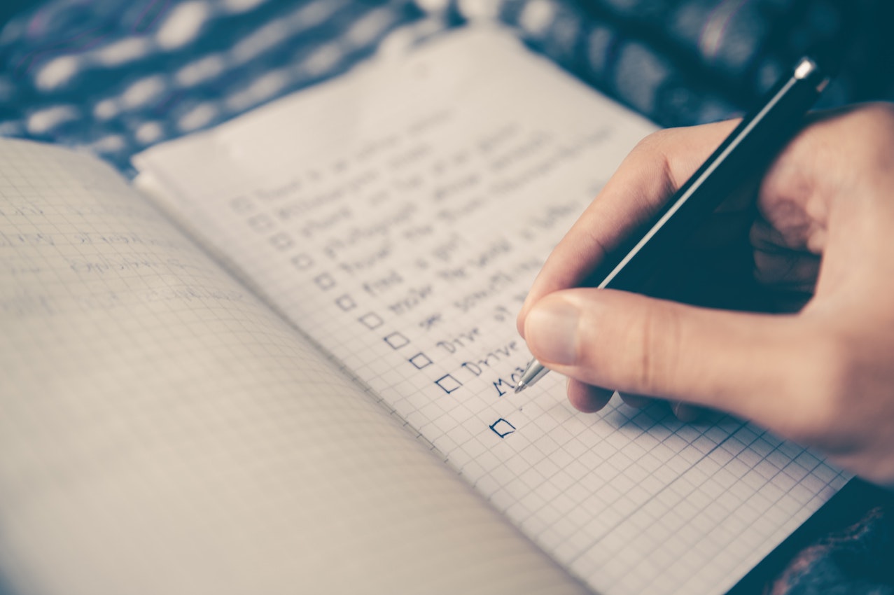 Person writing to-do list