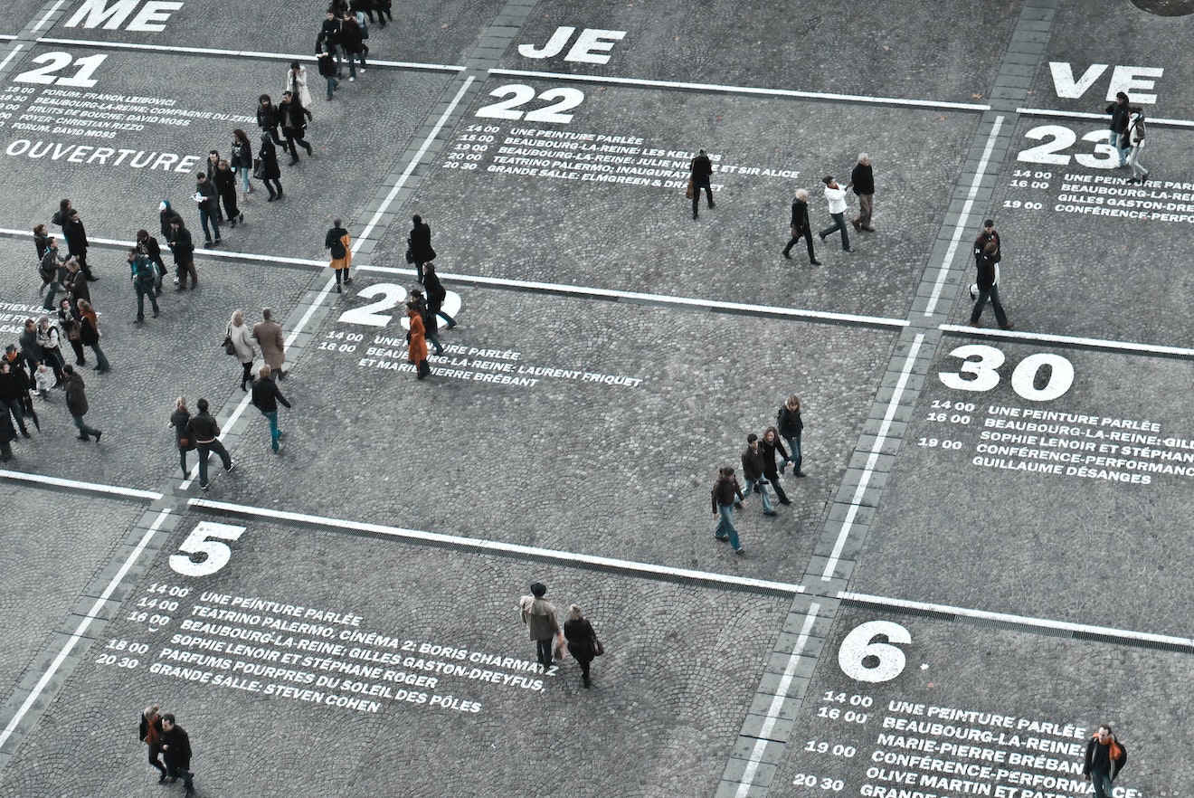 People walking on a huge calendar