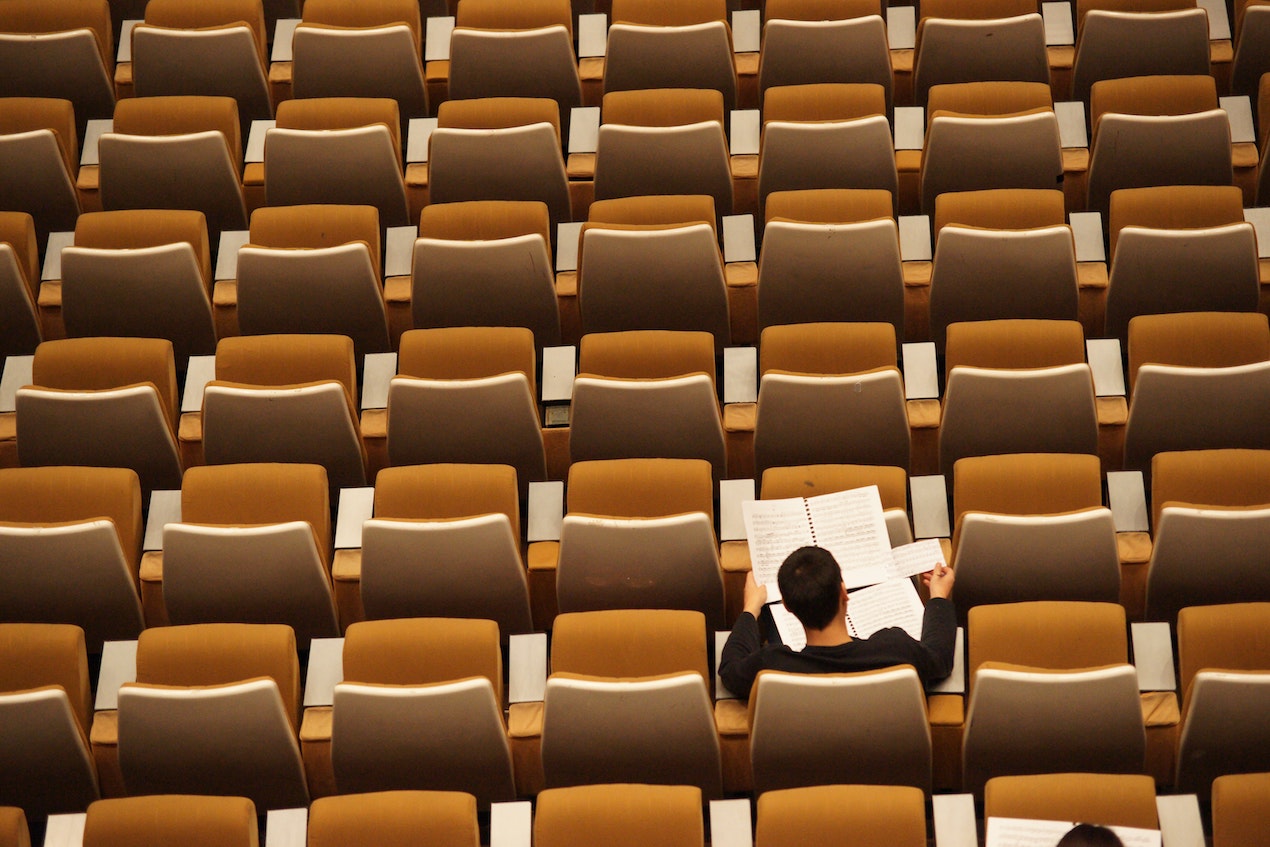 Man studying alone in hall