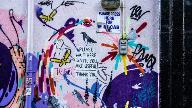 Graffiti on wall with word 'useful'