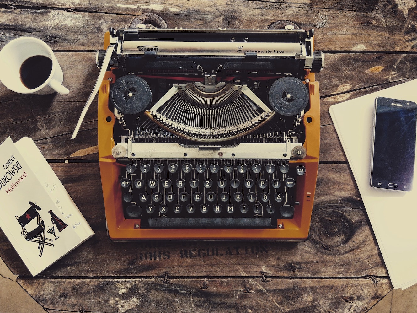 Brown typewriter on tabletop