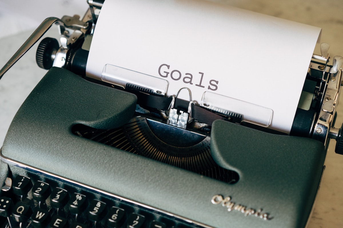 Typewriter with paper with 'goals' typed on it