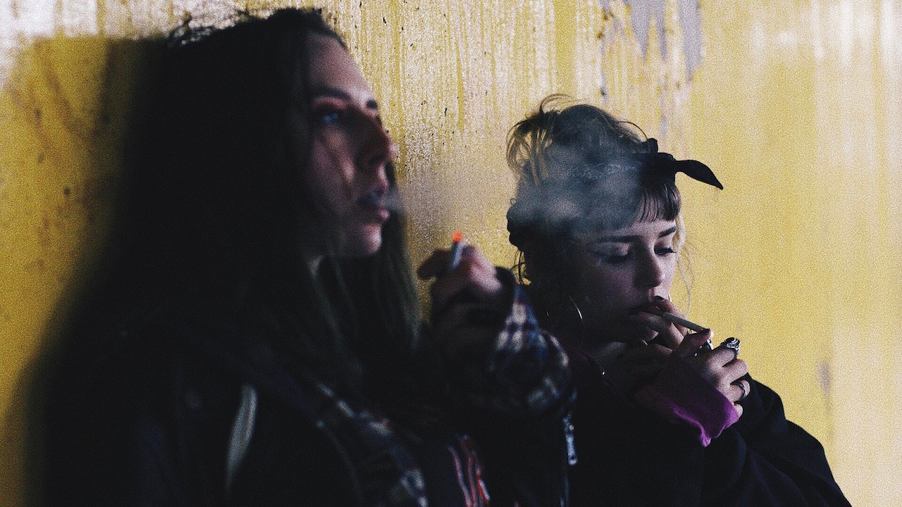 Two women smoking cigarettes