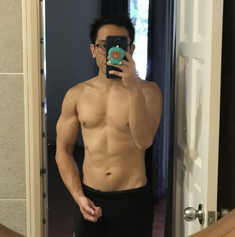 Stu standing topless in front of bathroom mirror