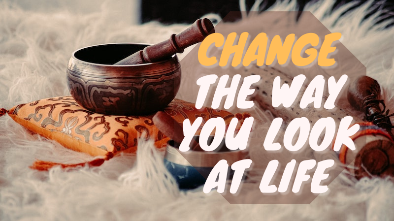 How to raise your vibration: Singing bowls for sound bath with the title: Change the way you look at life