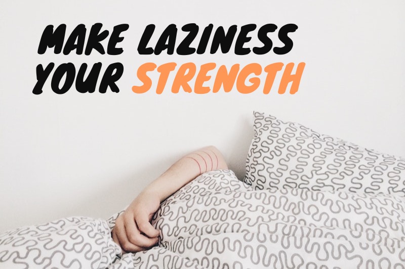 A hand sticking out from under the sheets, with